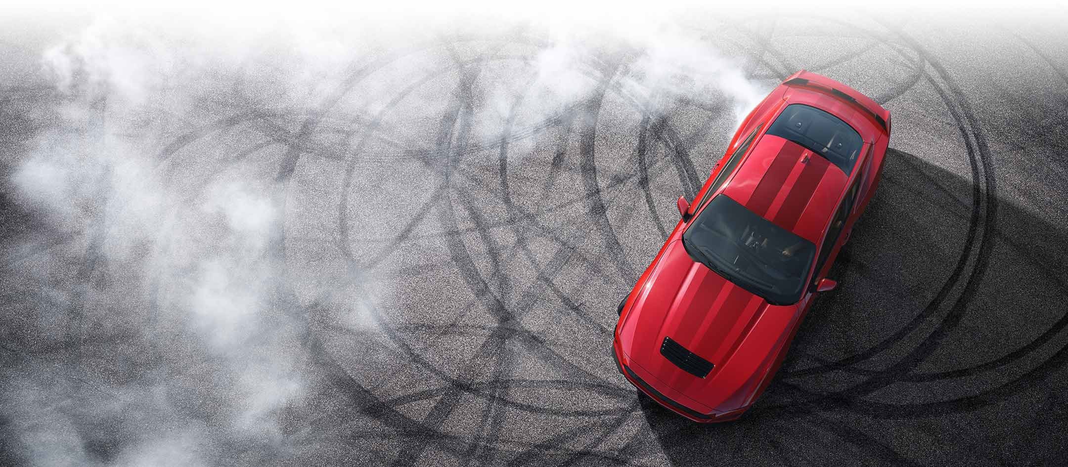 Overhead view of a 2024 Ford Mustang® model with tire tracks on pavement | Eau Claire Ford Lincoln in Eau Claire WI