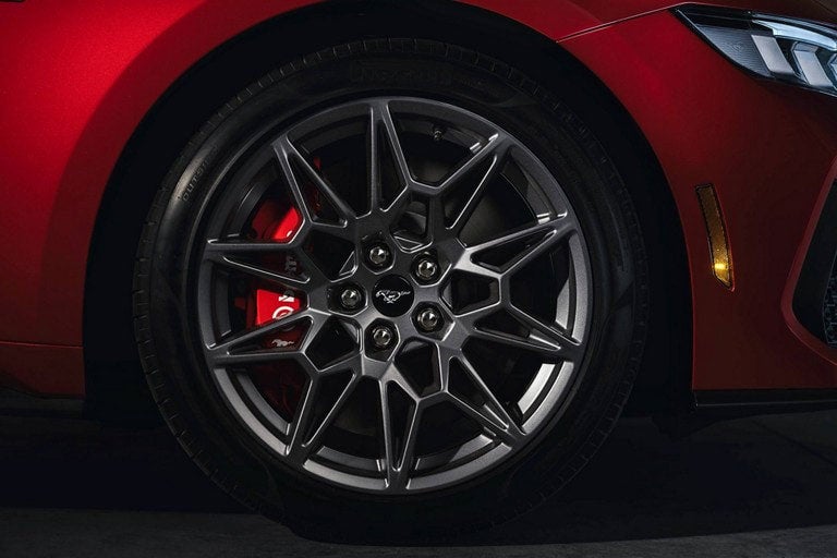 2024 Ford Mustang® model with a close-up of a wheel and brake caliper | Eau Claire Ford Lincoln in Eau Claire WI