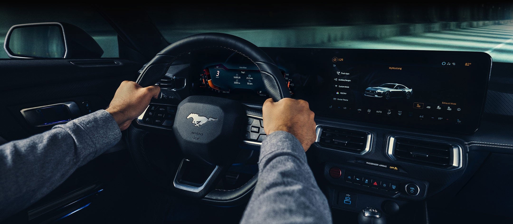 A 2024 Ford Mustang® model interior with a person driving | Eau Claire Ford Lincoln in Eau Claire WI